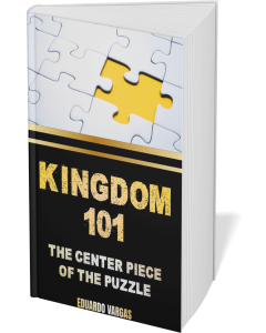 Book cover titled 'Kingdom 101' with puzzle-piece artwork and subtitle 'The Center Piece of the Puzzle' by Eduardo Vargas (black/dold aesthetic)